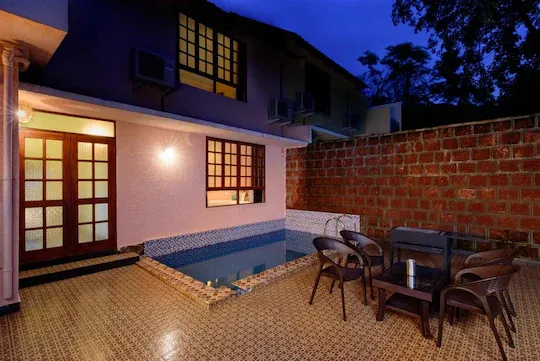 The Honeymoon Villa's private covered pool at dusk